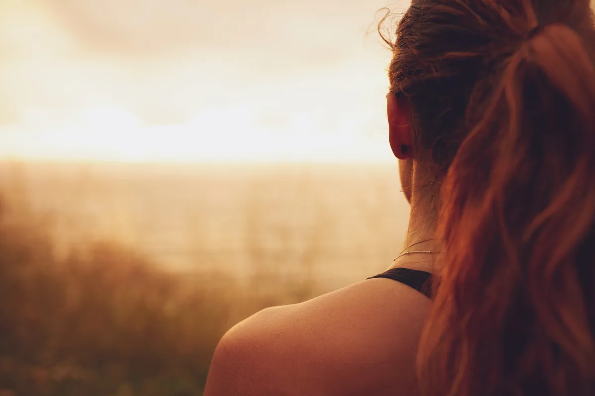 Woman looking at sunset