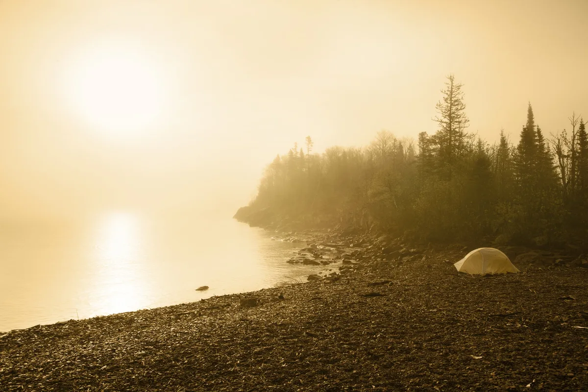 Camping Tent on Beach of Lake Superior with Sun and Mist