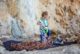 Little girl playing with rock climbing equipment